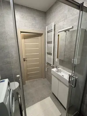 a bathroom with a sink and a toilet and a mirror at Studio 204 Vilnius Old Town in Vilnius