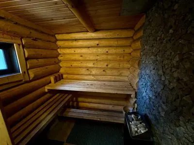 an inside view of a wooden sauna with a window at Vila Zara in Zarasai