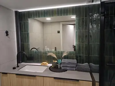 a bathroom with a sink and a mirror at Rooftop Terrace Loft 15 Minute Walk to Zalgiris Arena in Kaunas