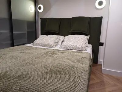 a bed with two pillows on top of it at Rooftop Terrace Loft 15 Minute Walk to Zalgiris Arena in Kaunas