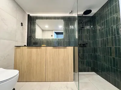 a bathroom with a shower and a toilet at Rooftop Terrace Loft 15 Minute Walk to Zalgiris Arena in Kaunas