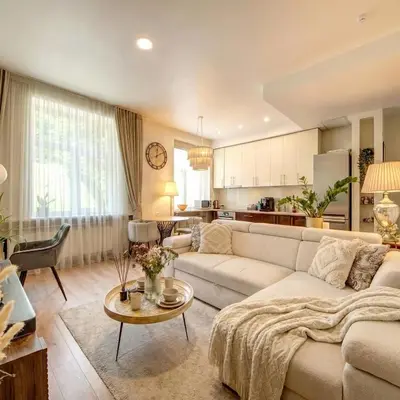 a living room with a couch and a table at Vilnius Central Apartment Free Parking in Vilnius