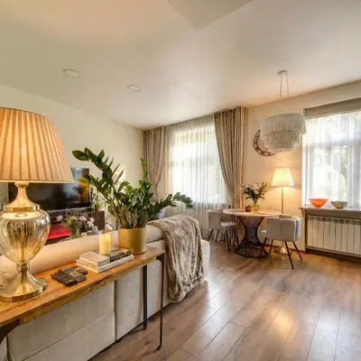 a living room with a couch and a table at Vilnius Central Apartment Free Parking in Vilnius