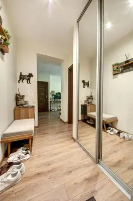 a room with a mirror and some shoes on the floor at Vilnius Central Apartment Free Parking in Vilnius