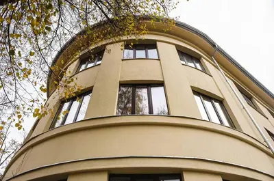 a tall building with windows on top of it at Kaunas Center Hostel - Self-Check In in Kaunas