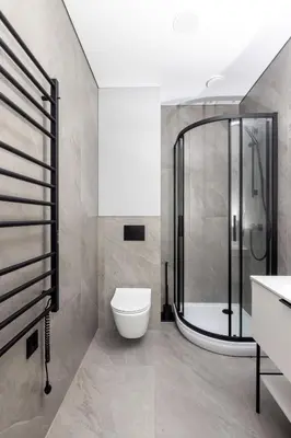 a bathroom with a shower and a toilet and a sink at Varenastay in Varėna