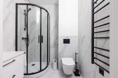a bathroom with a shower and a toilet and a sink at Varenastay in Varėna
