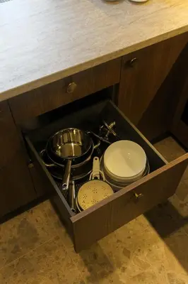 a drawer in a kitchen with pots and pans at K15 History Apartments in Vilnius