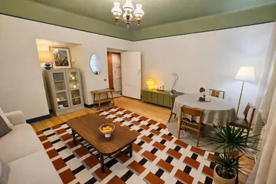 a living room with a table and a couch at K15 History Apartments in Vilnius
