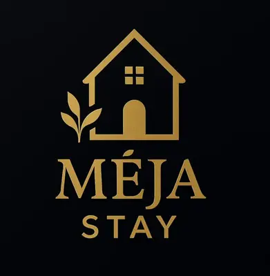 a logo of a house with the words mea stay at Mėja stay in Kaunas