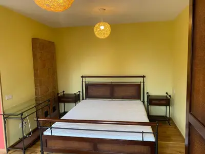 a bedroom with a bed and two night stands at Gudyno in Kaunas