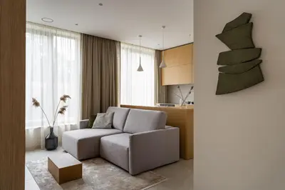 a living room with a couch and a table at Cozy one bedroom apartment in Vilnius Old Town in Vilnius