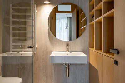 a bathroom with a sink and a mirror at Cozy one bedroom apartment in Vilnius Old Town in Vilnius