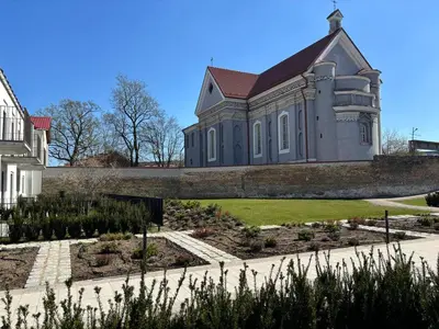 a house with a garden in front of it at Cozy one bedroom apartment in Vilnius Old Town in Vilnius