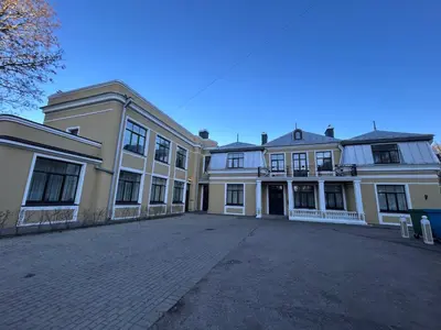 a large building with a driveway in front of it at Vydūno apartamentai 10 in Kaunas