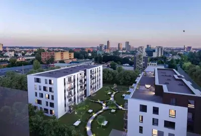 an aerial view of a building with a park at New luxury modern Apartment in Šnipiškės in Vilnius
