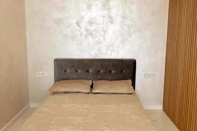 a bed with two pillows on it in a room at New luxury modern Apartment in Šnipiškės in Vilnius