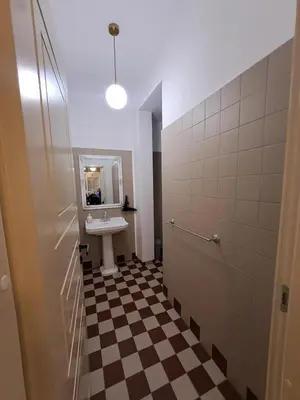 a bathroom with a sink and a mirror at Vydūno apartamentai 8 in Kaunas