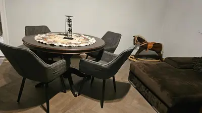a dining room with a table with a dog on it at Dviejų kambarių butas Kauno centre in Kaunas