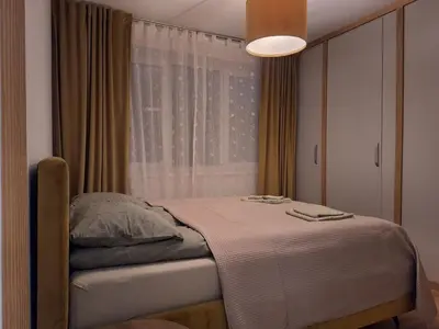 a bedroom with a bed in front of a window at Konarskio 3 kambarių butas in Vilnius