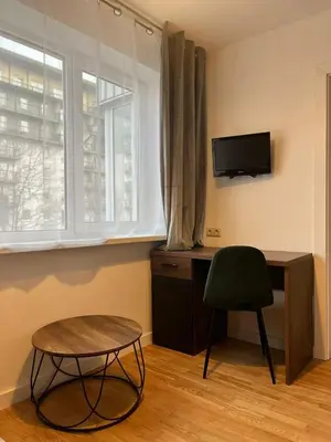 a room with a desk and a chair and a window at Konarskio 3 kambarių butas in Vilnius