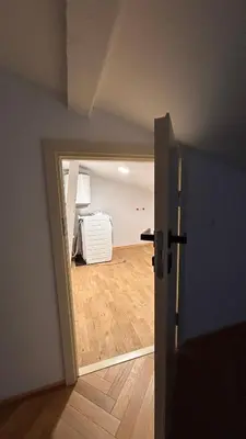an open door to an empty room with a room with a room at Vydūno apartamentai 12 in Kaunas