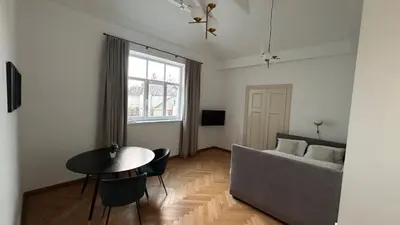 a living room with a couch and a table at Vyduno apartments 7 in Kaunas