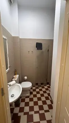 a bathroom with a toilet and a sink at Italian Embassy Suites 3 in Kaunas