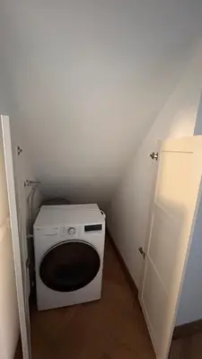 a washer and dryer in a small room at Italian Embassy Suites 3 in Kaunas