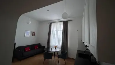 a living room with a couch and a table at Historic Embassy Apartments 1 in Kaunas