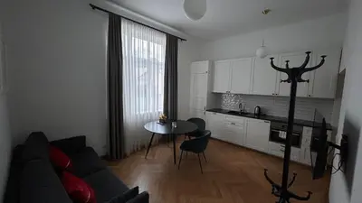 a living room with a couch and a table at Historic Embassy Apartments 1 in Kaunas