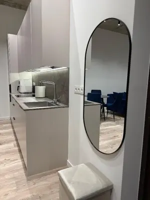 a bathroom with a mirror and a sink at Modern apartment near old town in Kaunas