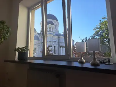 a window with a view of a building at Cathedral View Central Flat in Kaunas
