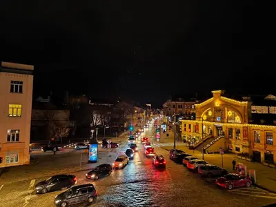 a group of cars parked on a street at night at OLD TOWN MARKET STAY , Self Check-in in Vilnius