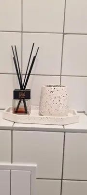 a shelf with a cake and a candle on it at Stay in Kaunas LA51A Standard - Free Parking in Kaunas
