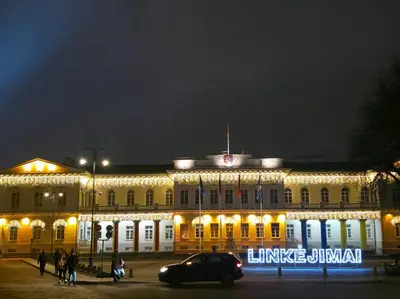 a large building with lights on it at night at K Spot in Old Town with Sauna and Jakuzzi in Vilnius