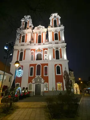 a large building is lit up at night at K Spot in Old Town with Sauna and Jakuzzi in Vilnius