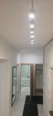 a room with a bathroom with a tub and a mirror at K Spot in Old Town with Sauna and Jakuzzi in Vilnius