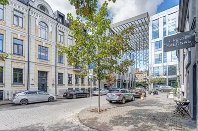a street with cars parked on the side of the road at Center Apartment near Hillton with self check-in in Vilnius