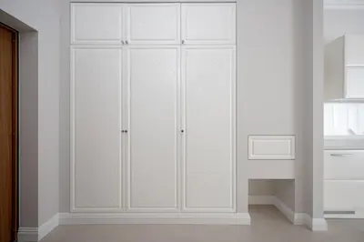 a white closet with white cabinets in a room at Luxury apartment Gedimino Pr Downtown with parking in Vilnius