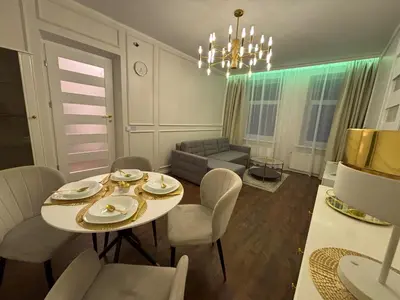 a living room with a table and chairs and a couch at Centre Modern Elegance Apartment in Kaunas 2026 fully renovated in Kaunas