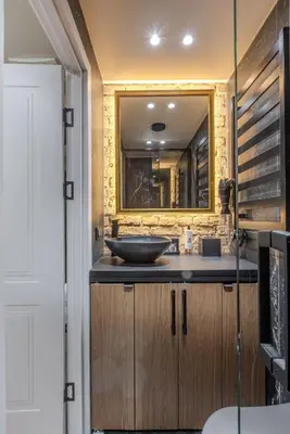 a bathroom with a sink and a mirror at Basanavičiaus apartament in Vilnius