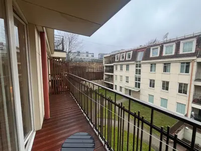 a balcony with a view of a building at V13 Apartment in Old Town in Vilnius