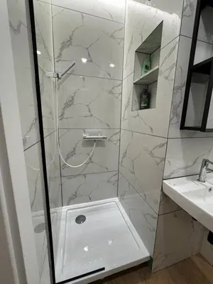 a bathroom with a shower and a sink at Greenhill in Kaunas