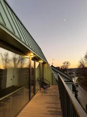 a balcony of a building with a bench on it at Designer Penthouse with Huge Terrace & Fast Wi-Fi in Kaunas