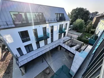an aerial view of a building with a balcony at Designer Penthouse with Huge Terrace & Fast Wi-Fi in Kaunas