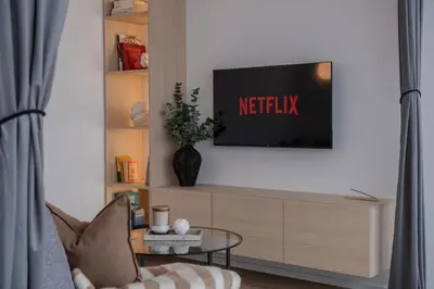 a living room with a tv on a wall at Designer Penthouse with Huge Terrace & Fast Wi-Fi in Kaunas