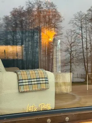 a couch sitting in front of a window at Jack namai 2 in Puodžiai