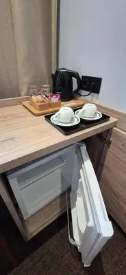 a table with two plates and dishes on it at Private Room - Hotel Building in Vilnius