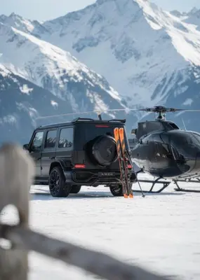 a black jeep parked next to a helicopter at Atgal i gamta in Ukmergė